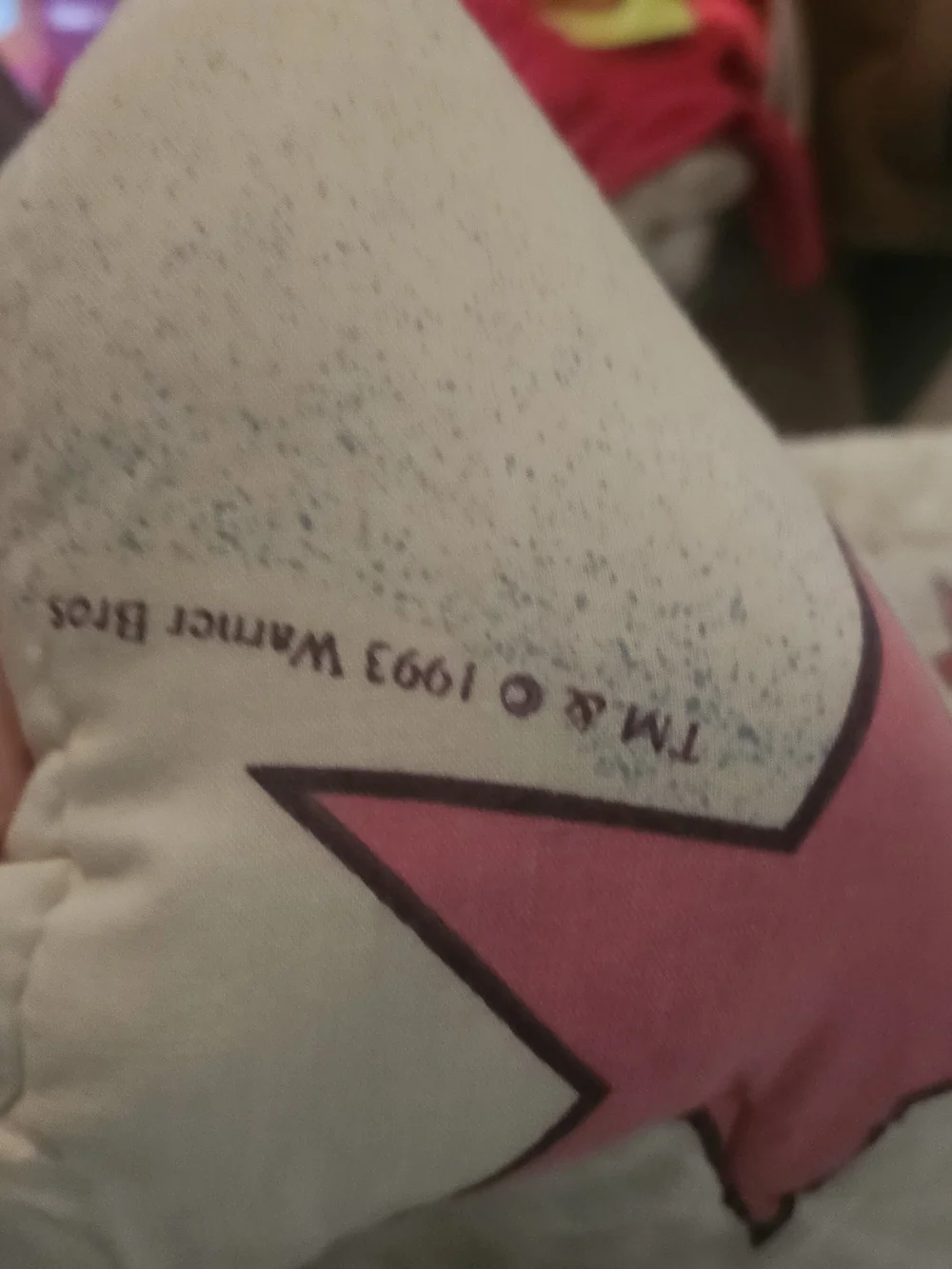 The item in the image is a vintage 1993 Baby Looney Tunes quilted crib blanket